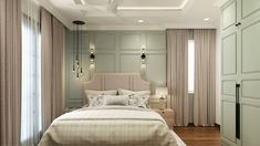 a large bed sitting under a window next to a wall mounted light fixture in a bedroom