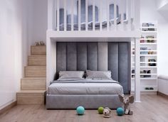 there is a bed that has been built into the wall in this room with stairs leading up to it