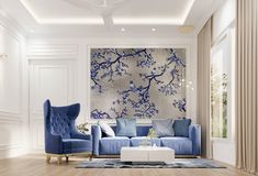 a living room filled with furniture and a large painting hanging on the wall above it