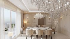 an elegant dining room with chandelier and large windows
