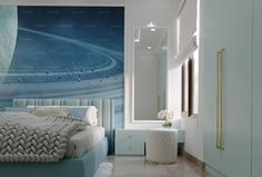 a bed room with a neatly made bed and a large wall mural on the wall