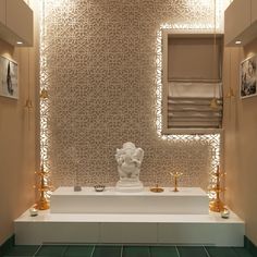 the bathroom is decorated in gold and white
