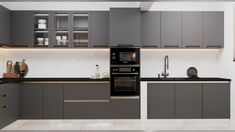 a modern kitchen with grey cabinets and white flooring